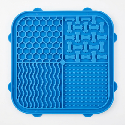 Blue silicone lick mat with four textured sections and suction cups for dogs and cats